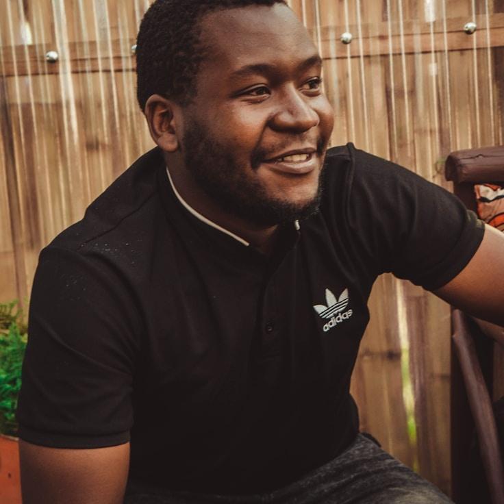 Aisha Karim, Lead Design Curator at Current Evening Shade, reviewing corporate floral arrangements